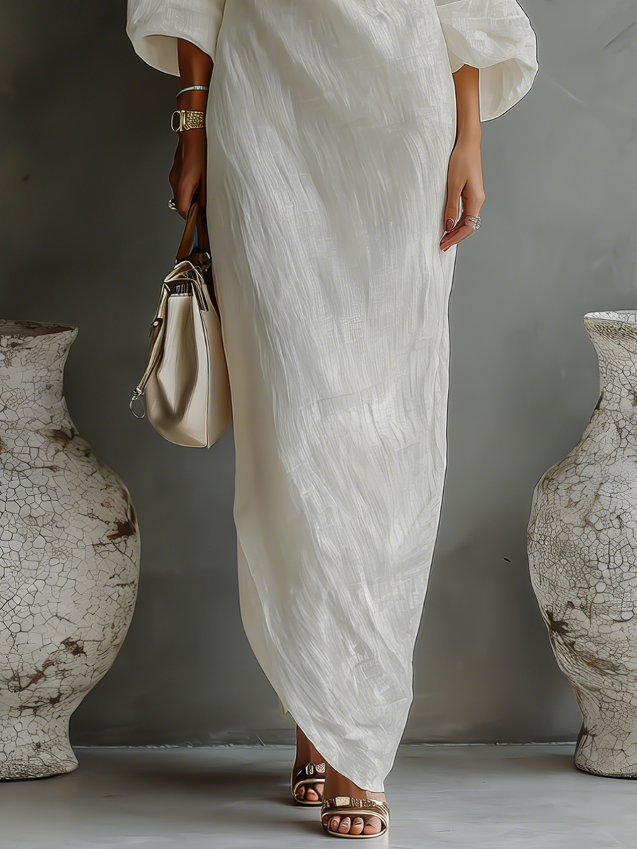 Elegant off-shoulder linen dress in a flowy style, perfect for summer. Image 6 of 8.