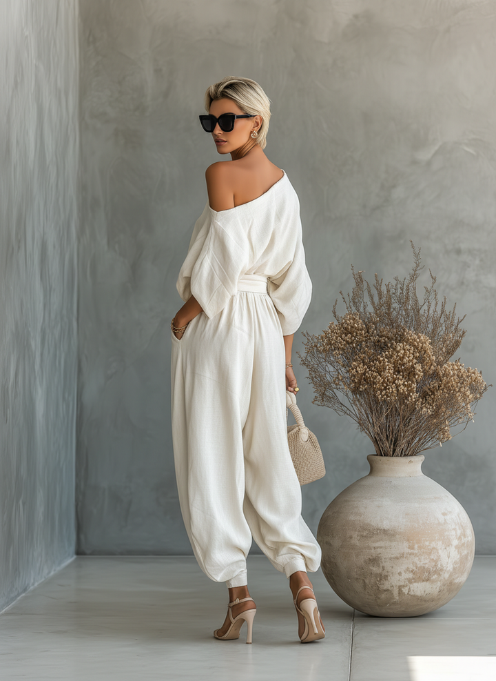Linen off-shoulder top and wide-leg pants set, woman in natural light, full outfit, style inspiration.